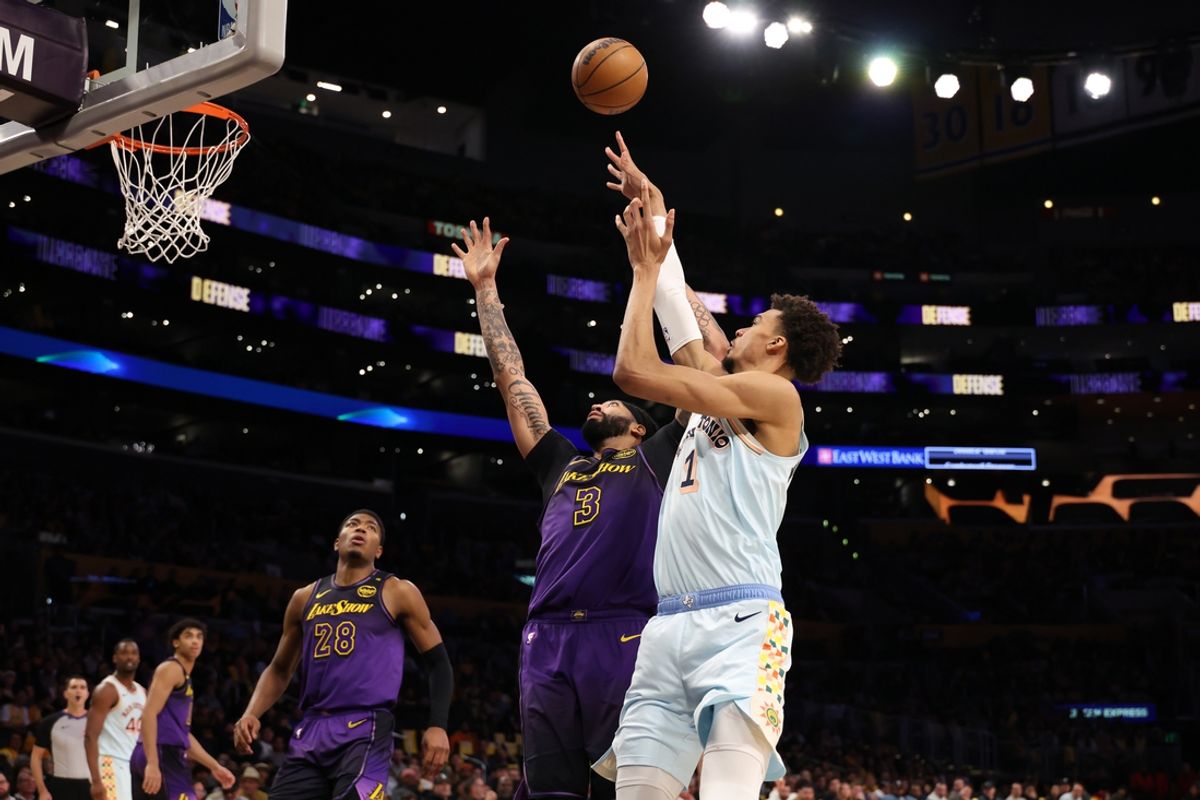 Jan 13, 2025; Los Angeles, California, USA;  San Antonio Spurs center Victor Wembanyama (1) shoots the ball against Los Angeles Lakers forward Anthony Davis (3) during the second half at Crypto.com Arena. Mandatory Credit: Kiyoshi Mio-Imagn Images