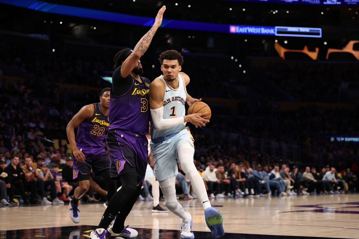 Jan 13, 2025; Los Angeles, California, USA;  San Antonio Spurs center Victor Wembanyama (1) drives to the basket against Los Angeles Lakers forward Anthony Davis (3) during the second half at Crypto.com Arena. Mandatory Credit: Kiyoshi Mio-Imagn Images