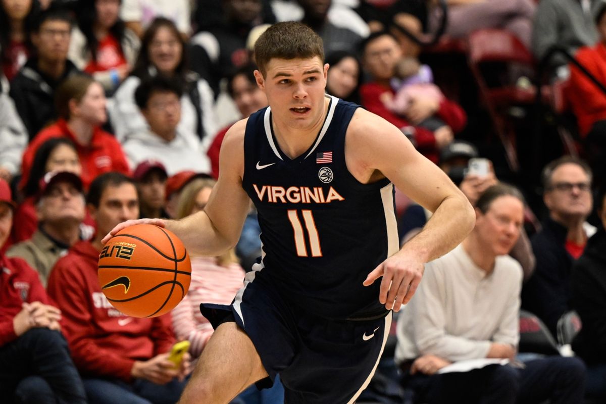 Jan 11, 2025; Stanford, California, USA; Virginia Cavaliers guard Isaac McKneely (11) dribbles against the Stanford Cardinal in the first half at Maples Pavilion. Mandatory Credit: Eakin Howard-Imagn Images