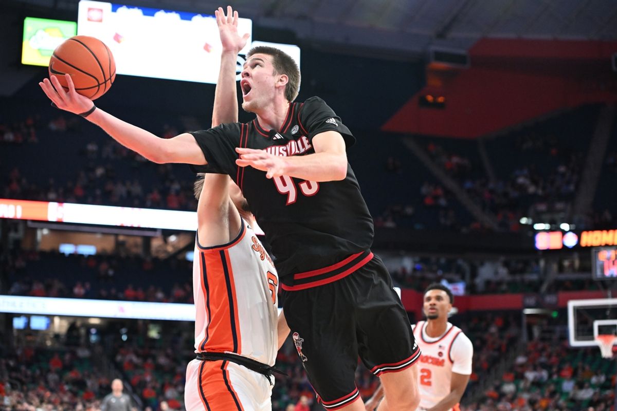 Jan 14, 2025; Syracuse, New York, USA; Louisville Cardinals forward Noah Waterman (93) makes a lay up against the Syracuse Orange in the first half at the JMA Wireless Dome. Mandatory Credit: Mark Konezny-Imagn Images