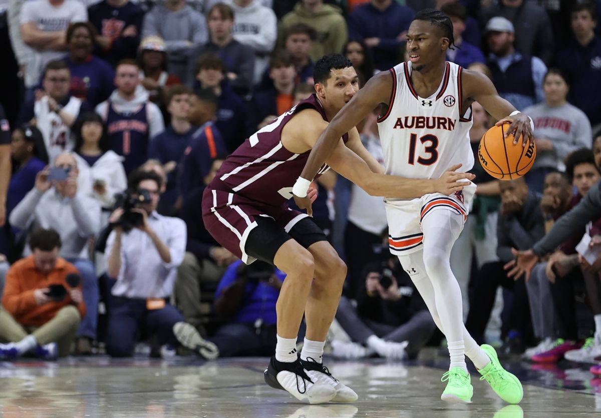 Jan 14, 2025; Auburn, Alabama, USA;  Mississippi State Bulldogs forward RJ Melendez (22) defends against Auburn Tigers guard Miles Kelly (13) during the first half at Neville Arena. Mandatory Credit: John Reed-Imagn Images