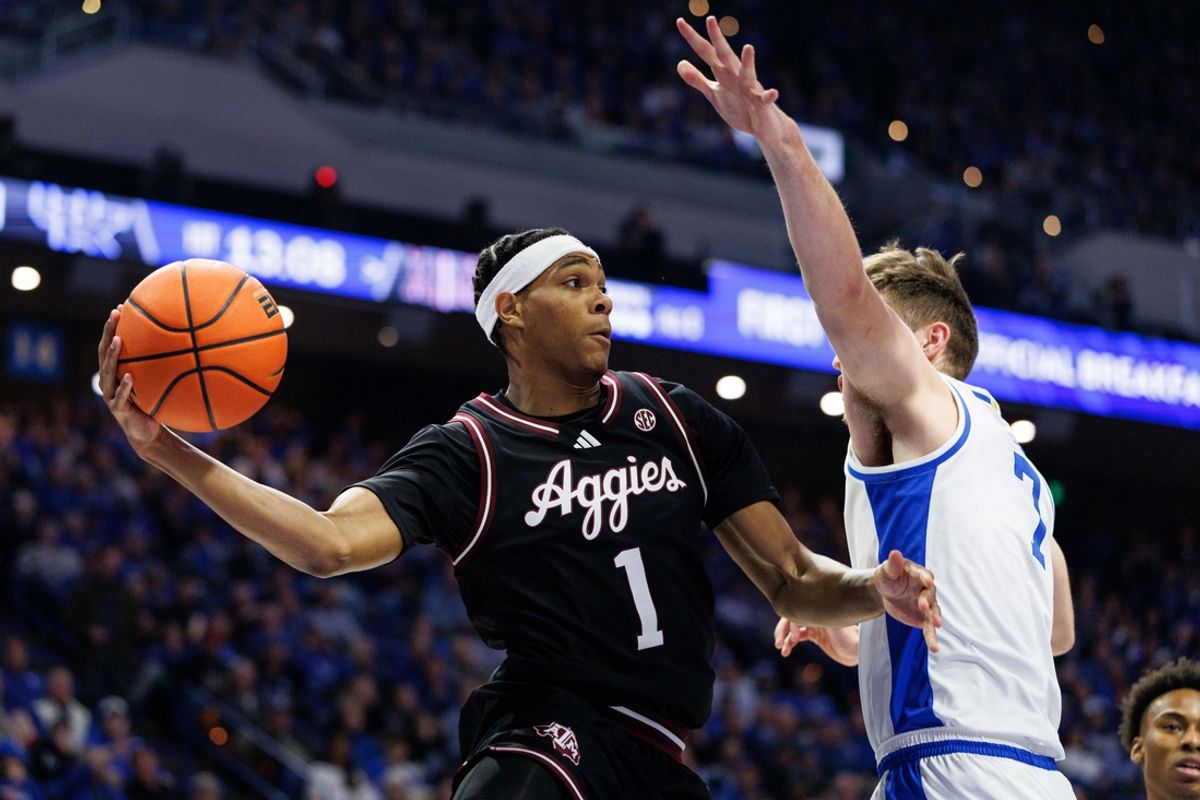 Jan 14, 2025; Lexington, Kentucky, USA; Texas A&M Aggies guard Zhuric Phelps (1) passes the ball during the first half against the Kentucky Wildcats at Rupp Arena at Central Bank Center. Mandatory Credit: Jordan Prather-Imagn Images