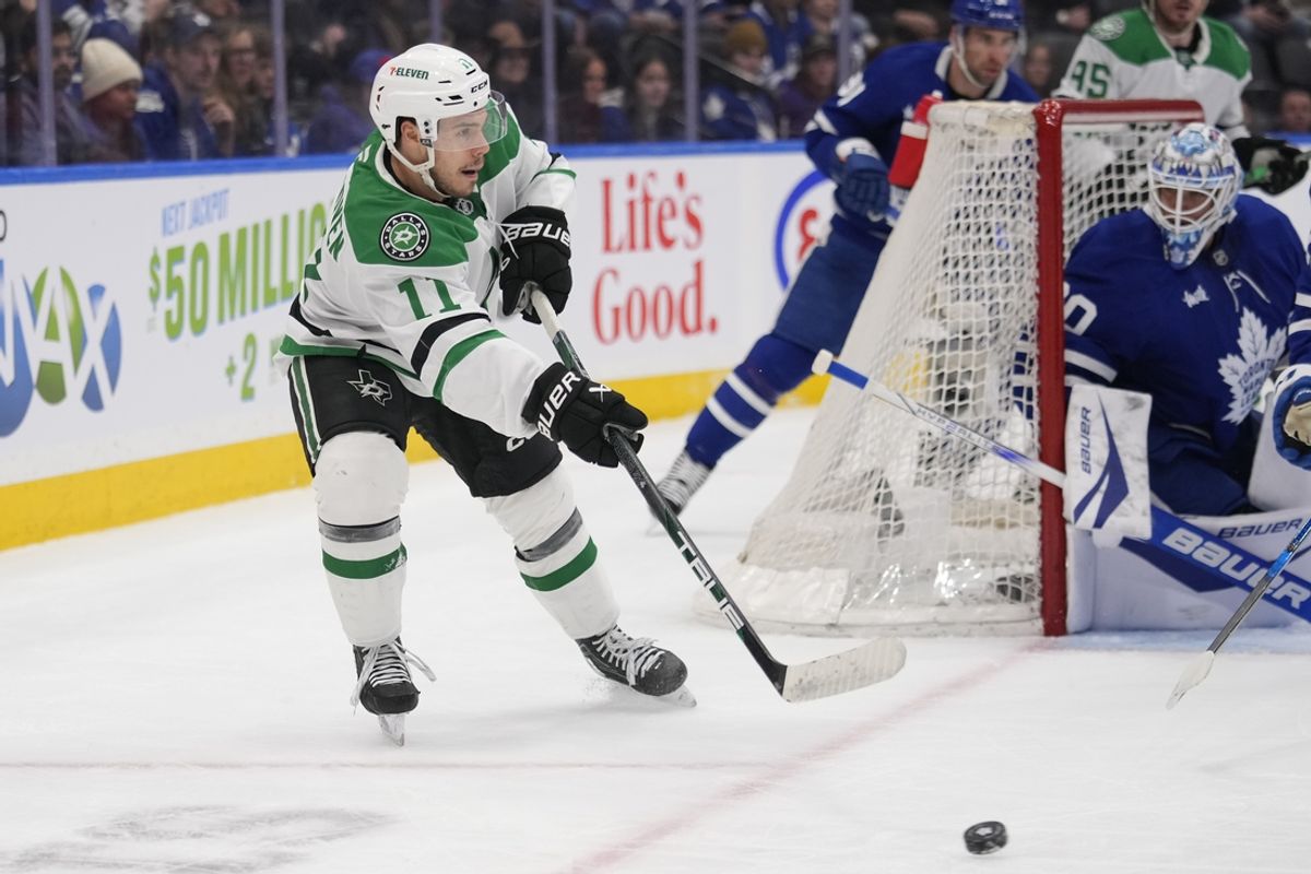 Jan 14, 2025; Toronto, Ontario, CAN; Dallas Stars forward Logan Stankoven (11) passes the puck against the Toronto Maple Leafs during the second period at Scotiabank Arena. Mandatory Credit: John E. Sokolowski-Imagn Images