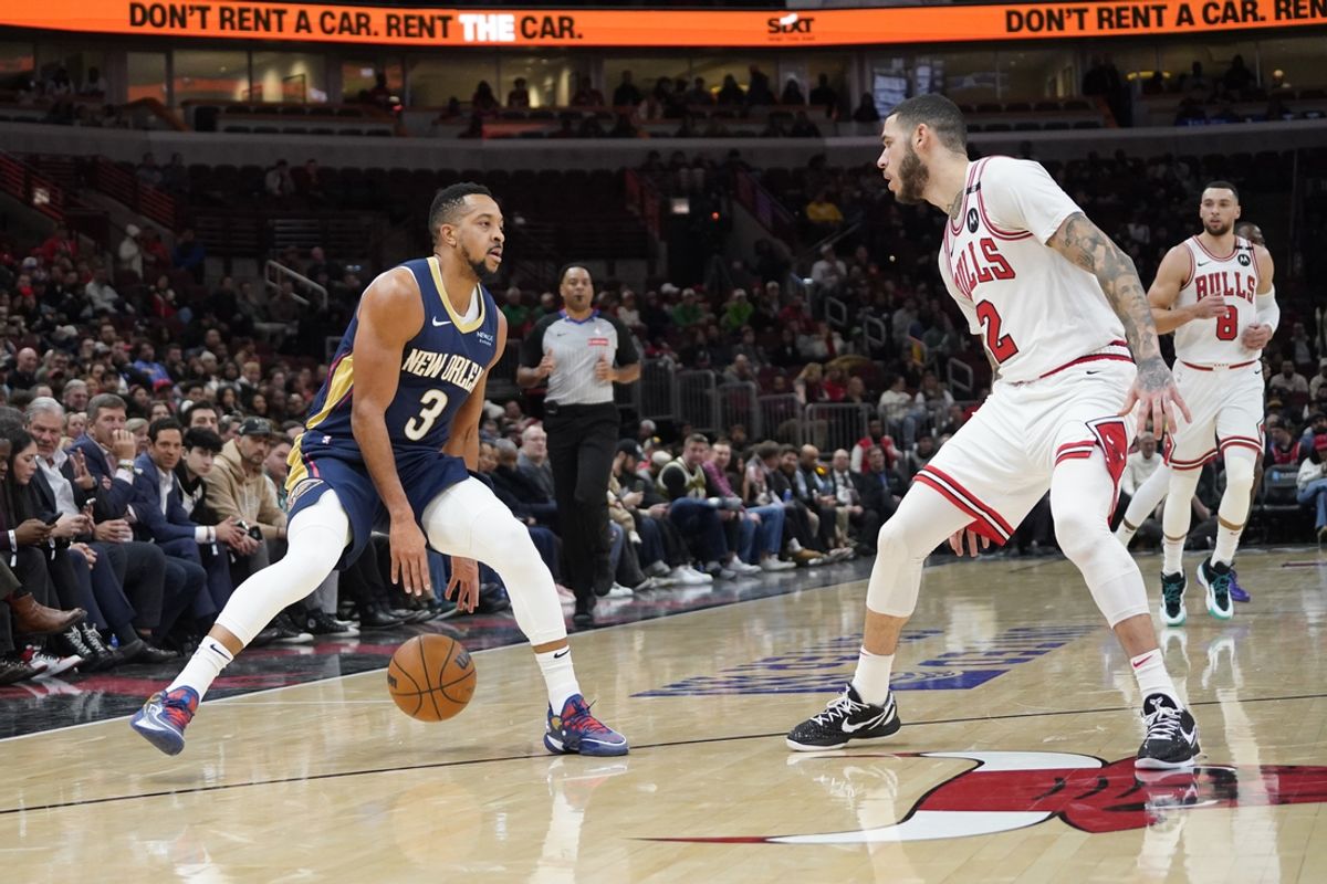 Jan 14, 2025; Chicago, Illinois, USA; Chicago Bulls guard Lonzo Ball (2) defends New Orleans Pelicans guard CJ McCollum (3) during the first quarter at United Center. Mandatory Credit: David Banks-Imagn Images