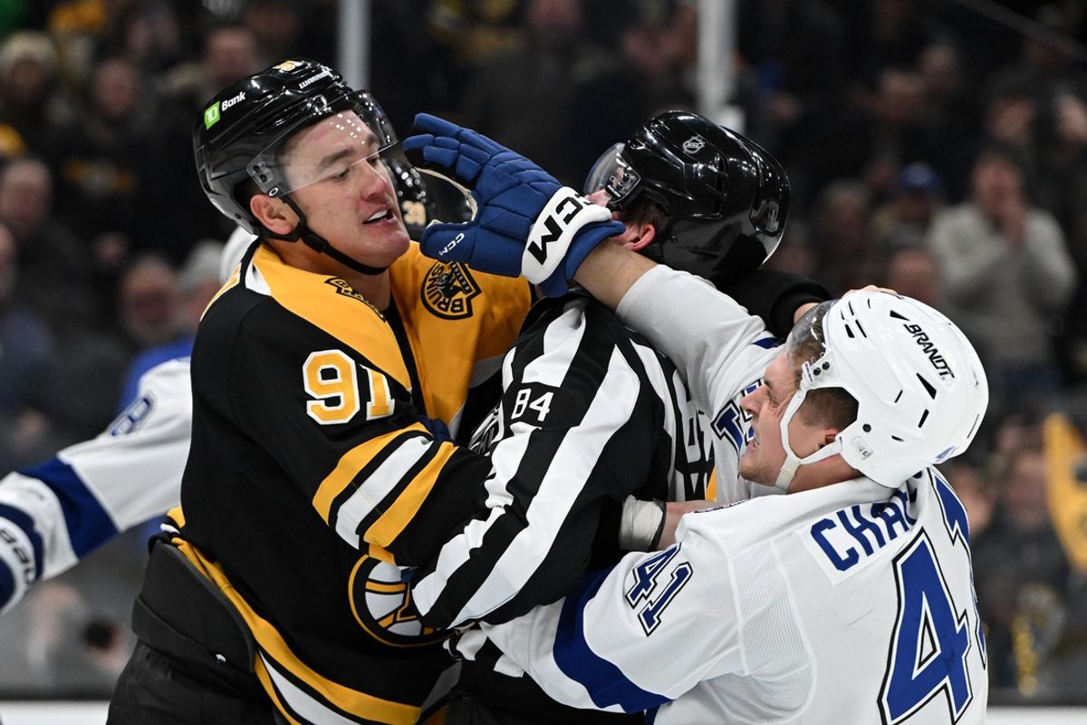 Jan 14, 2025; Boston, Massachusetts, USA; Boston Bruins defenseman Nikita Zadorov (91) and Tampa Bay Lightning right wing Mitchell Chaffee (41) shove each other after a whistle during the second period at the TD Garden. Mandatory Credit: Brian Fluharty-Imagn Images