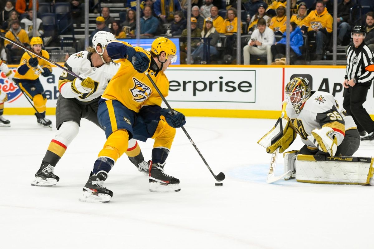 Jan 14, 2025; Nashville, Tennessee, USA;  Vegas Golden Knights goaltender Ilya Samsonov (35) blocks the shot of Nashville Predators center Fedor Svechkiv (40) during the first period at Bridgestone Arena. Mandatory Credit: Steve Roberts-Imagn Images