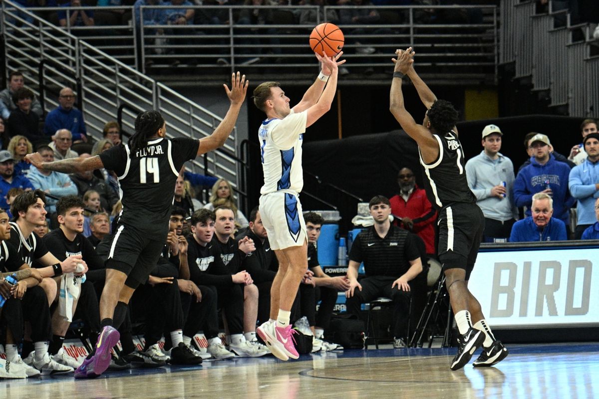 Jan 14, 2025; Omaha, Nebraska, USA;  Creighton Bluejays guard Steven Ashworth (1) attempts a three point shot against Providence Friars guard Jayden Pierre (1) and guard Corey Floyd Jr. (14) during the first half at CHI Health Center Omaha. Mandatory Credit: Steven Branscombe-Imagn Images