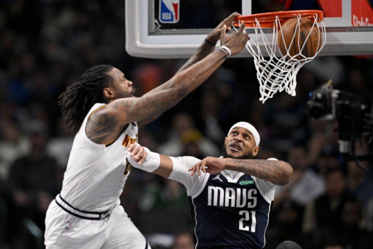 Jan 14, 2025; Dallas, Texas, USA; Denver Nuggets center DeAndre Jordan (6) dunks the ball over Dallas Mavericks center Daniel Gafford (21) during the second quarter at the American Airlines Center. Mandatory Credit: Jerome Miron-Imagn Images