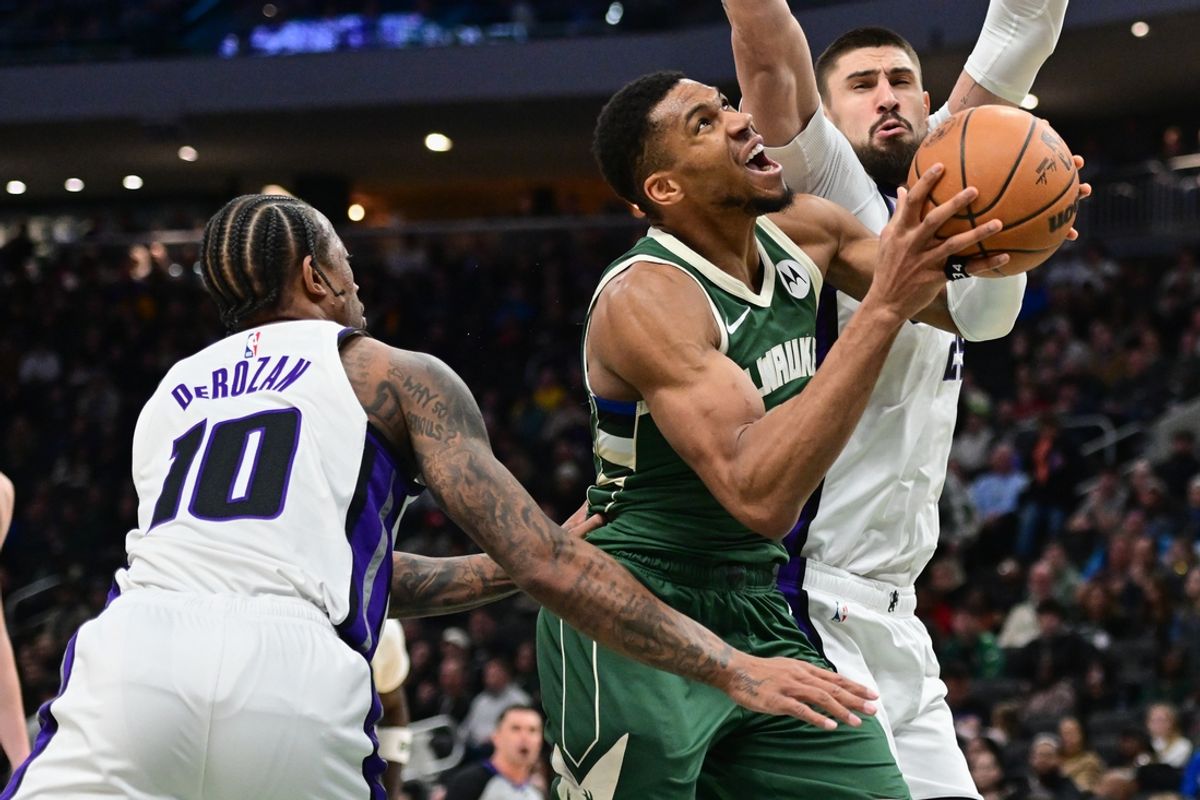 Jan 14, 2025; Milwaukee, Wisconsin, USA; Milwaukee Bucks forward Giannis Antetokounmpo (34) looks for a shot against Sacramento Kings forward DeMar DeRozan (10) in the third quarter at Fiserv Forum. Mandatory Credit: Benny Sieu-Imagn Images