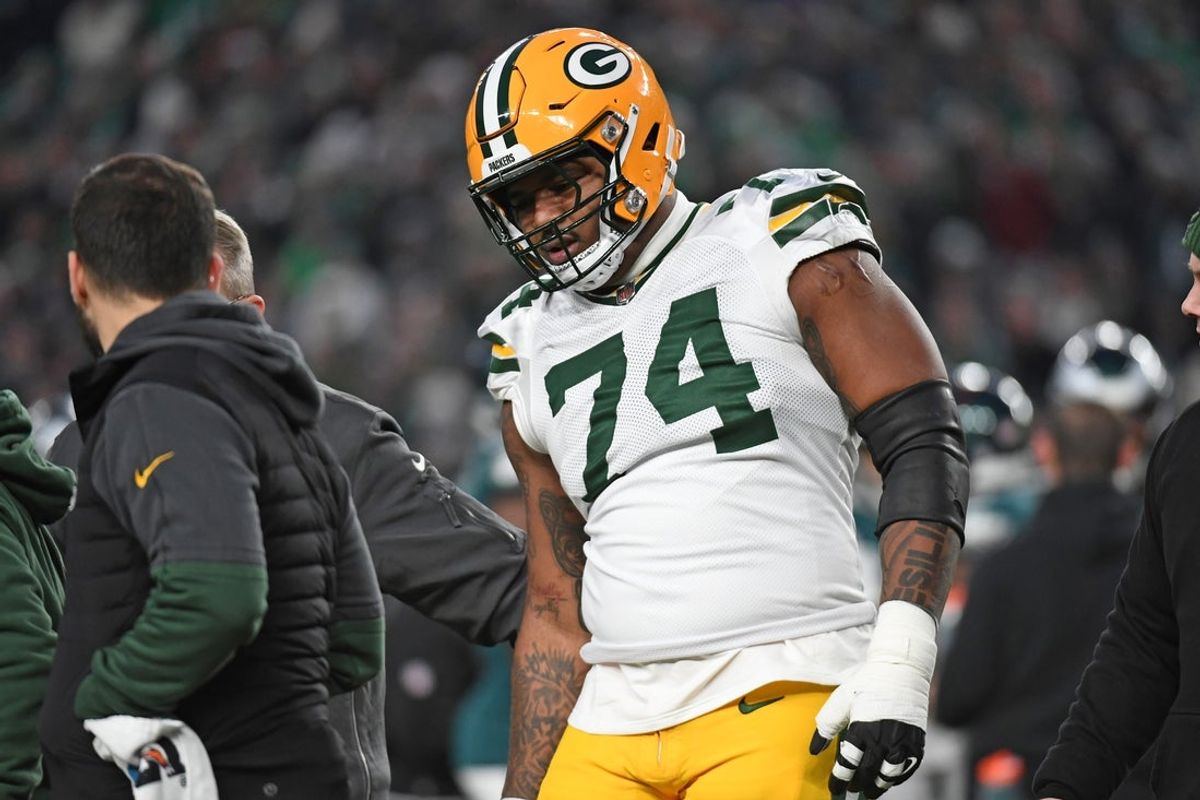 Jan 12, 2025; Philadelphia, Pennsylvania, USA; Green Bay Packers guard Elgton Jenkins (74) walks off the field with an injury against the Philadelphia Eagles in an NFC wild card game at Lincoln Financial Field. Mandatory Credit: Eric Hartline-Imagn Images