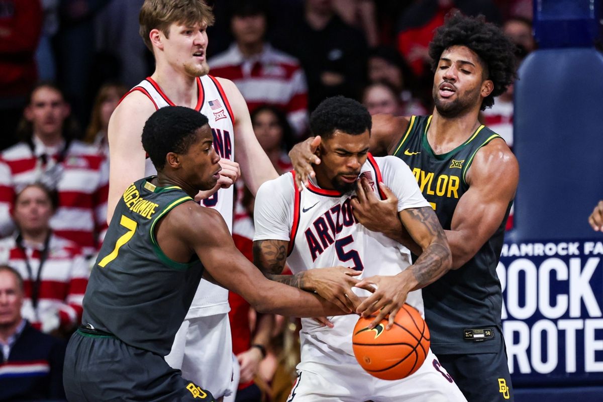 Jan 14, 2025; Tucson, Arizona, USA; Arizona Wildcats guard KJ Lewis (5) loses control over the ball against Baylor Bears guard VJ Edgecombe (7) and forward Norchad Omier (15) during the second half at McKale Center. Mandatory Credit: Aryanna Frank-Imagn Images