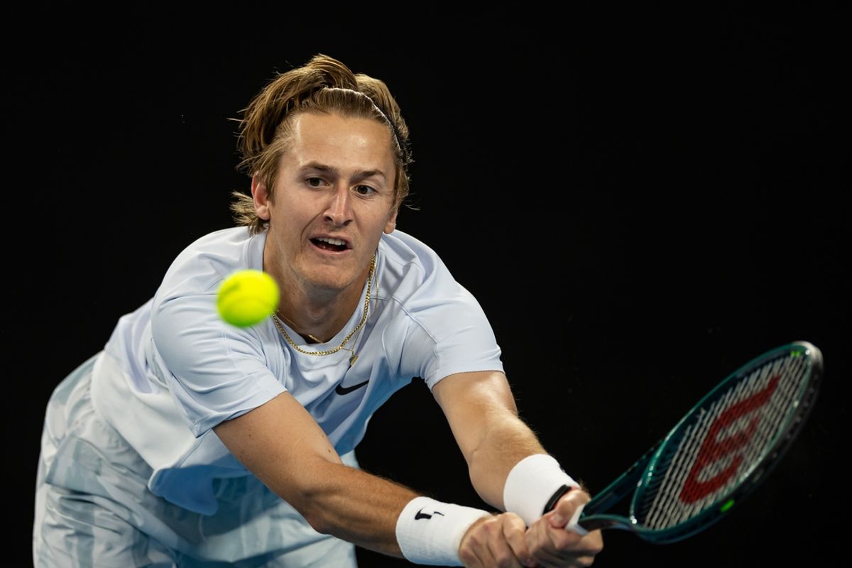 Jan 15, 2025; Melbourne, Victoria, Australia; Sebastian Korda of United States of America plays a backhand during his match against Aleksandar Vukic of Australia in the second round of the men's singles at the 2025 Australian Open at Melbourne Park. Mandatory Credit: Mike Frey-Imagn Images