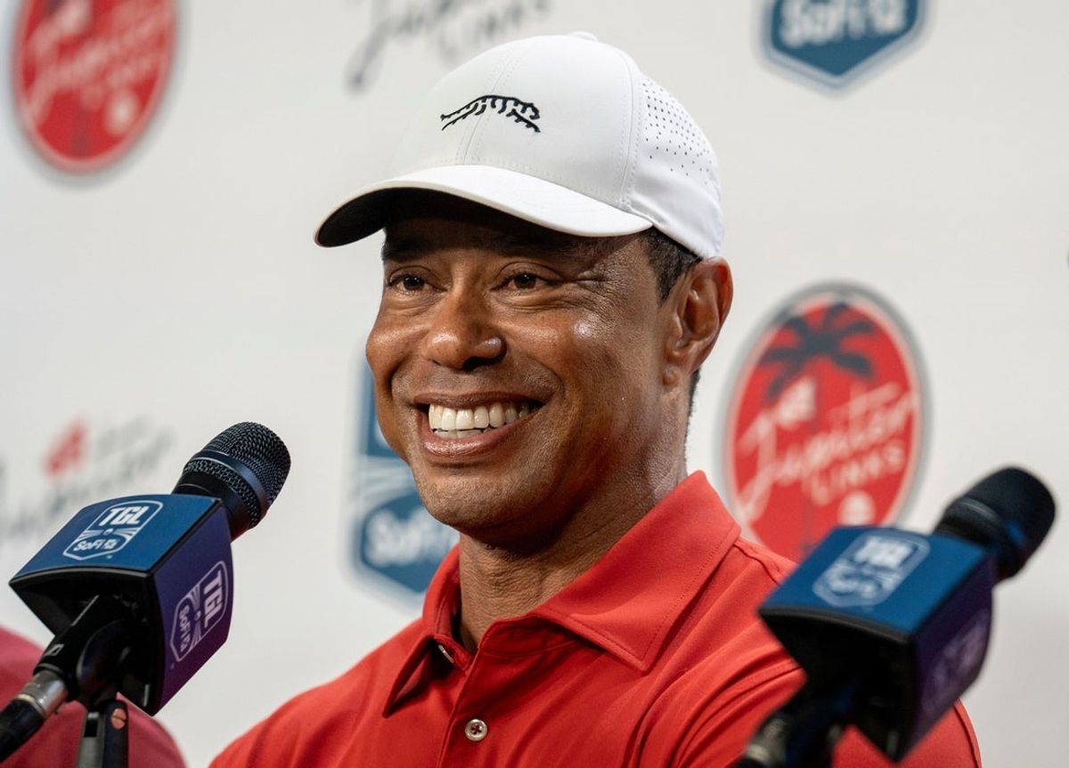 Golfer Tiger Woods smiles during a press conference after play at SoFi Center for golf match between Jupiter Links Golf Club and Los Angeles Golf Club in the TGL, the interactive golf league founded by Woods and Rory McIlroy on January 14, 2025 at Palm Beach State College in Palm Beach Gardens, Florida.