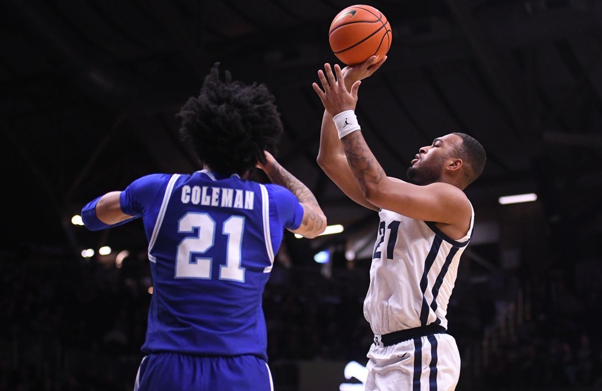Jan 15, 2025; Indianapolis, Indiana, USA; Butler Bulldogs forward Pierre Brooks II (21) scores over Seton Hall Pirates guard Isaiah Coleman (21) during the first half at Hinkle Fieldhouse. Mandatory Credit: Robert Goddin-Imagn Images
