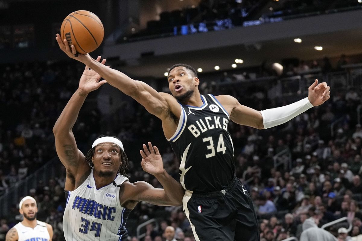 Jan 15, 2025; Milwaukee, Wisconsin, USA;  Milwaukee Bucks forward Giannis Antetokounmpo (34) reaches for a rebound during the second quarter against the Orlando Magic at Fiserv Forum. Mandatory Credit: Jeff Hanisch-Imagn Images