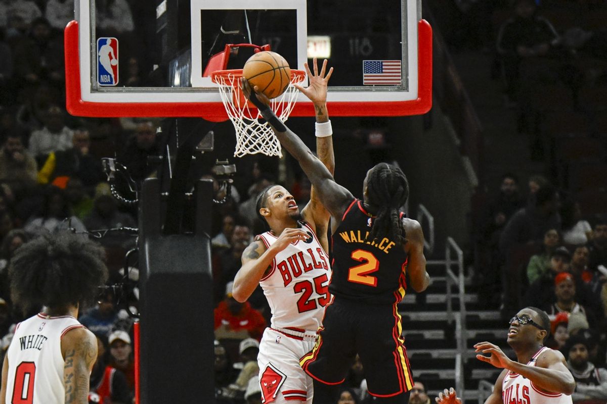 Jan 15, 2025; Chicago, Illinois, USA;  Atlanta Hawks guard Keaton Wallace (2) shoots against Chicago Bulls forward Dalen Terry (25) during the first half at the United Center. Mandatory Credit: Matt Marton-Imagn Images