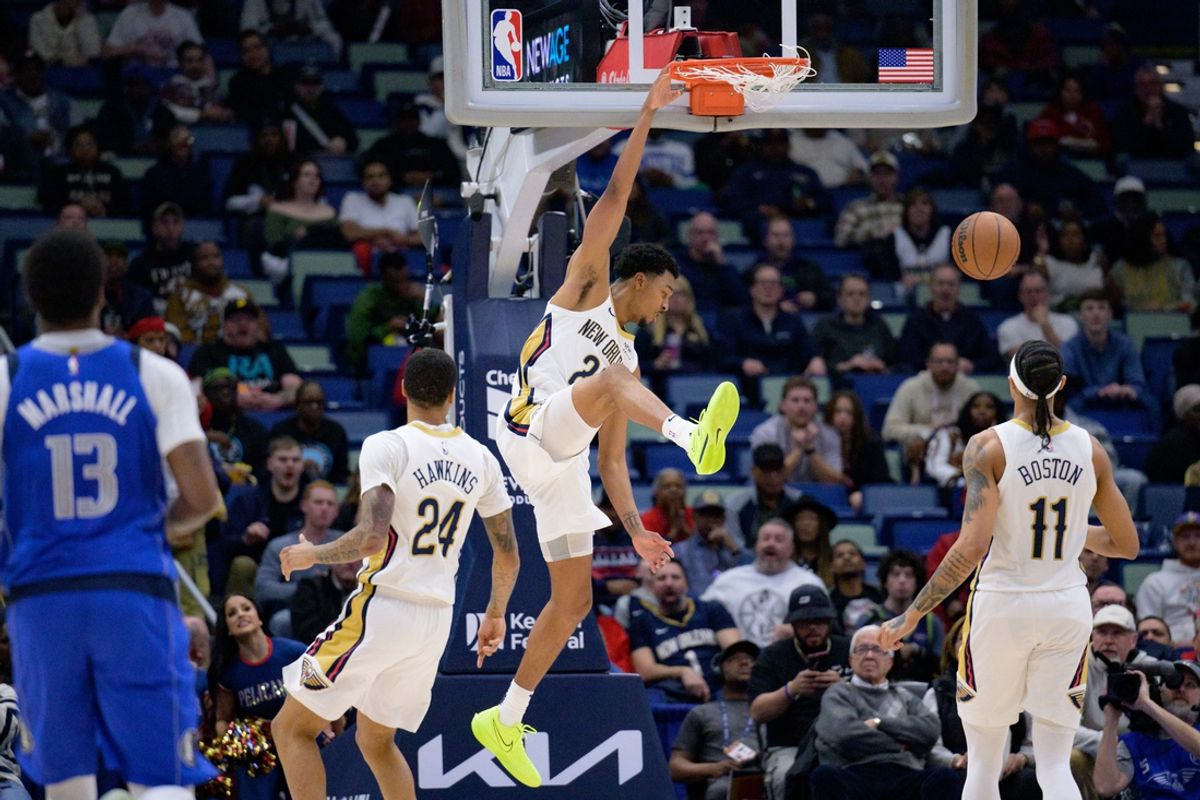 Jan 15, 2025; New Orleans, Louisiana, USA; New Orleans Pelicans guard Trey Murphy III (25) dunks against the Dallas Mavericks during the first half at Smoothie King Center. Mandatory Credit: Matthew Hinton-Imagn Images