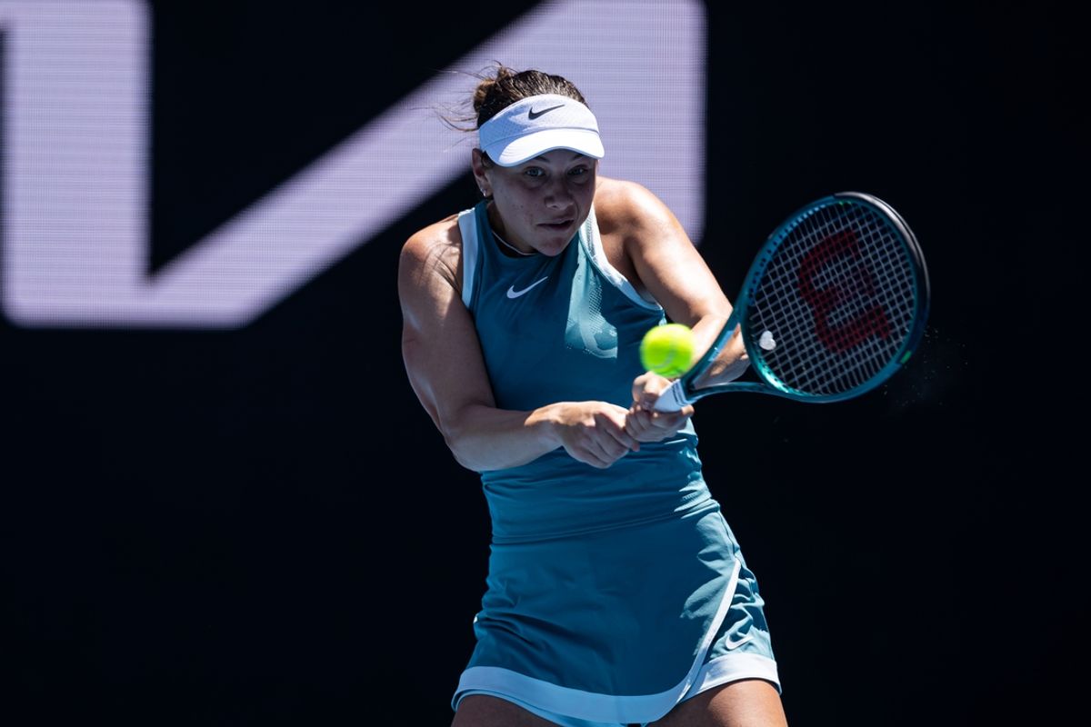 Jan 16, 2025; Melbourne, Victoria, Australia; Amanda Anisimova of United States of America plays a backhand during her match against Emma Raducanu of United Kingdom in the second round of the women's singles at the 2025 Australian Open at Melbourne Park. Mandatory Credit: Mike Frey-Imagn Images