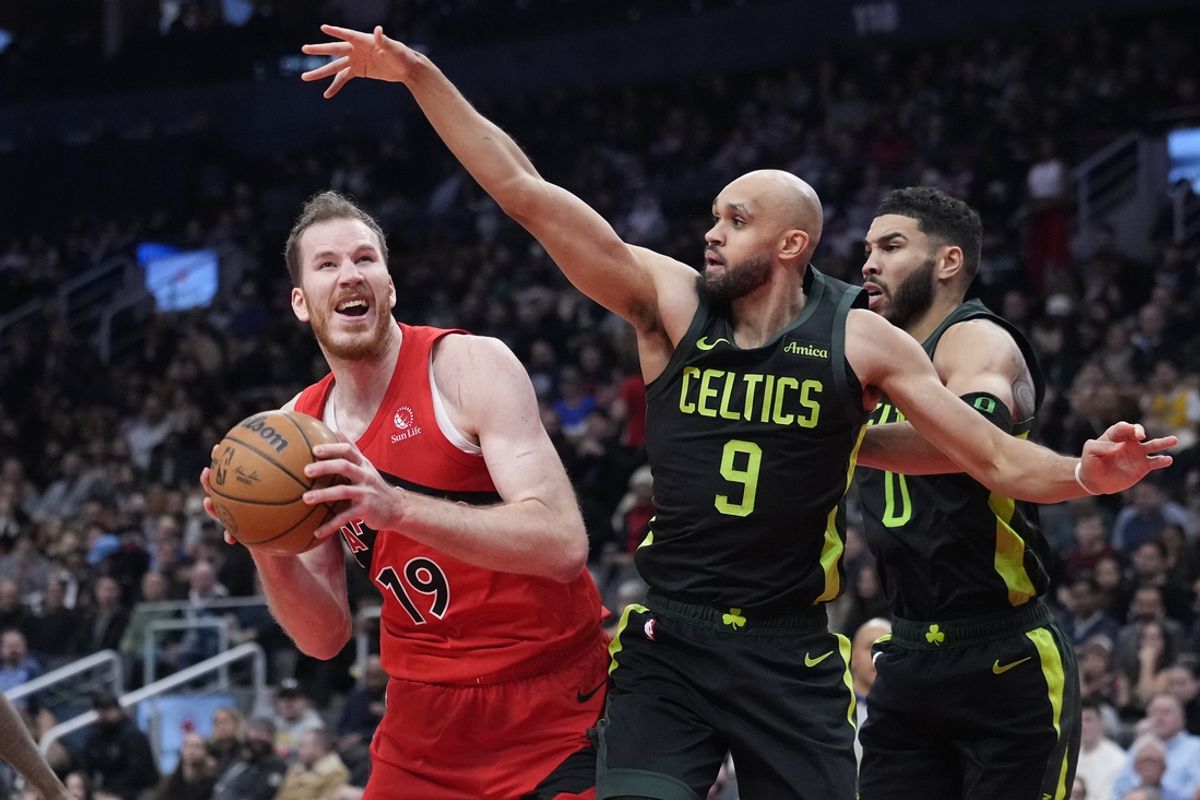 Jan 15, 2025; Toronto, Ontario, CAN; Boston Celtics guard Derrick White (9) defends Toronto Raptors center Jakob Poeltl (19) during the second half at Scotiabank Arena. Mandatory Credit: John E. Sokolowski-Imagn Images