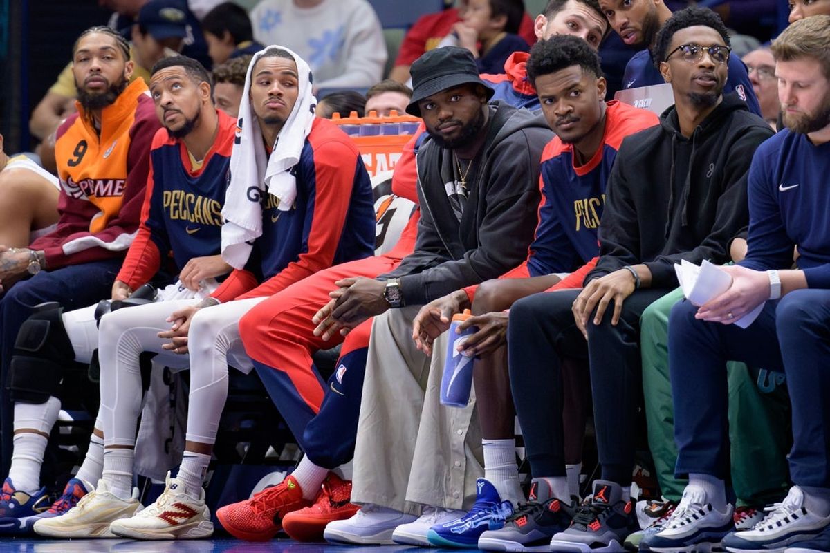 Jan 15, 2025; New Orleans, Louisiana, USA; New Orleans Pelicans forward Brandon Ingram, guard CJ McCollum, guard Dejounte Murray, forward Zion Williamson, center Yves Missi, and forward Herbert Jones watch from the bench during the second half against the Dallas Mavericks at Smoothie King Center. Mandatory Credit: Matthew Hinton-Imagn Images
