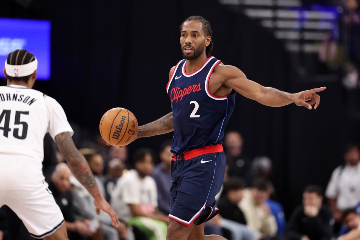 Jan 15, 2025; Inglewood, California, USA;  LA Clippers forward Kawhi Leonard (2) dribbles against Brooklyn Nets guard Keon Johnson (45) during the first half at Intuit Dome. Mandatory Credit: Kiyoshi Mio-Imagn Images