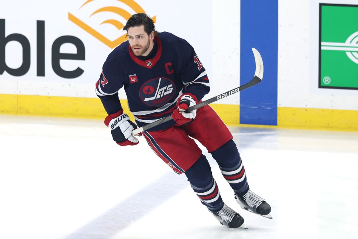 Jan 16, 2025; Winnipeg, Manitoba, CAN; Winnipeg Jets center Adam Lowry (17) warms up before a game against the Seattle Kraken at Canada Life Centre. Mandatory Credit: James Carey Lauder-Imagn Images