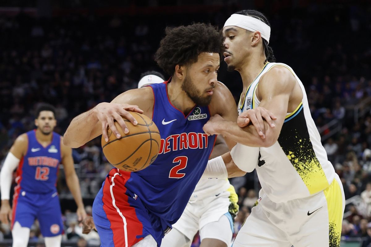 Jan 16, 2025; Detroit, Michigan, USA;  Detroit Pistons guard Cade Cunningham (2) dribbles on Indiana Pacers guard Andrew Nembhard (2) in the first half at Little Caesars Arena. Mandatory Credit: Rick Osentoski-Imagn Images