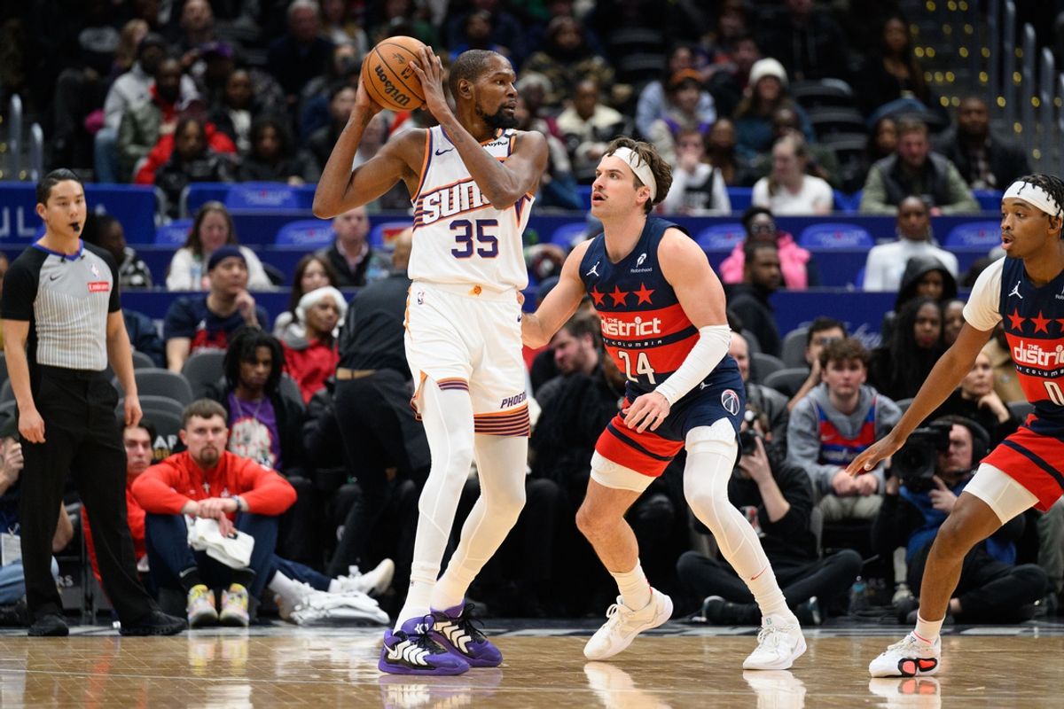Jan 16, 2025; Washington, District of Columbia, USA; Phoenix Suns forward Kevin Durant (35) posts up Washington Wizards forward Corey Kispert (24) during the first quarter at Capital One Arena. Mandatory Credit: Reggie Hildred-Imagn Images