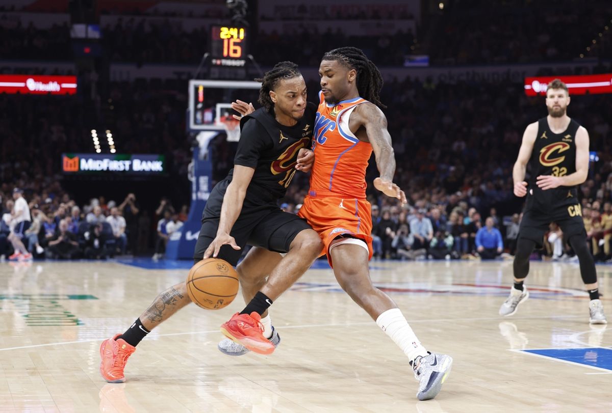 Jan 16, 2025; Oklahoma City, Oklahoma, USA; Cleveland Cavaliers guard Darius Garland (10) drives to the basket as Oklahoma City Thunder guard Cason Wallace (22) defends during the second quarter at Paycom Center. Mandatory Credit: Alonzo Adams-Imagn Images
