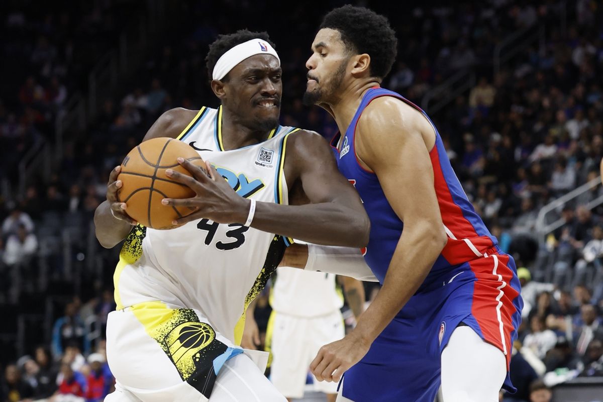 Jan 16, 2025; Detroit, Michigan, USA;  Indiana Pacers forward Pascal Siakam (43) dribbles against Detroit Pistons forward Tobias Harris (12) in the second half at Little Caesars Arena. Mandatory Credit: Rick Osentoski-Imagn Images
