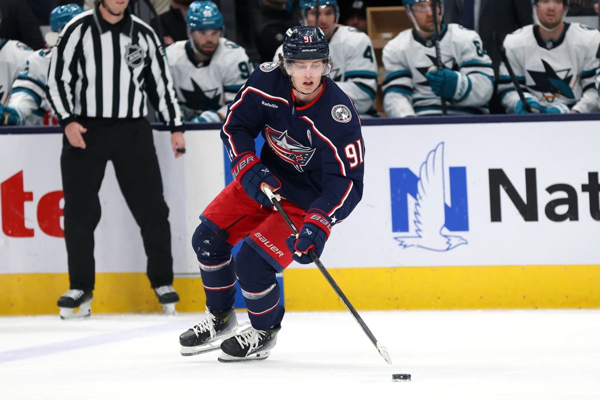 Jan 16, 2025; Columbus, Ohio, USA; Columbus Blue Jackets center Kent Johnson (91) controls the puck during the first period against the San Jose Sharks at Nationwide Arena. Mandatory Credit: Joseph Maiorana-Imagn Images