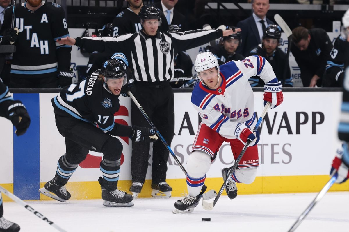 Jan 16, 2025; Salt Lake City, Utah, USA; New York Rangers defenseman Adam Fox (23) moves the puck against Utah Hockey Club center Nick Bjugstad (17) during the first period at Delta Center. Mandatory Credit: Rob Gray-Imagn Images