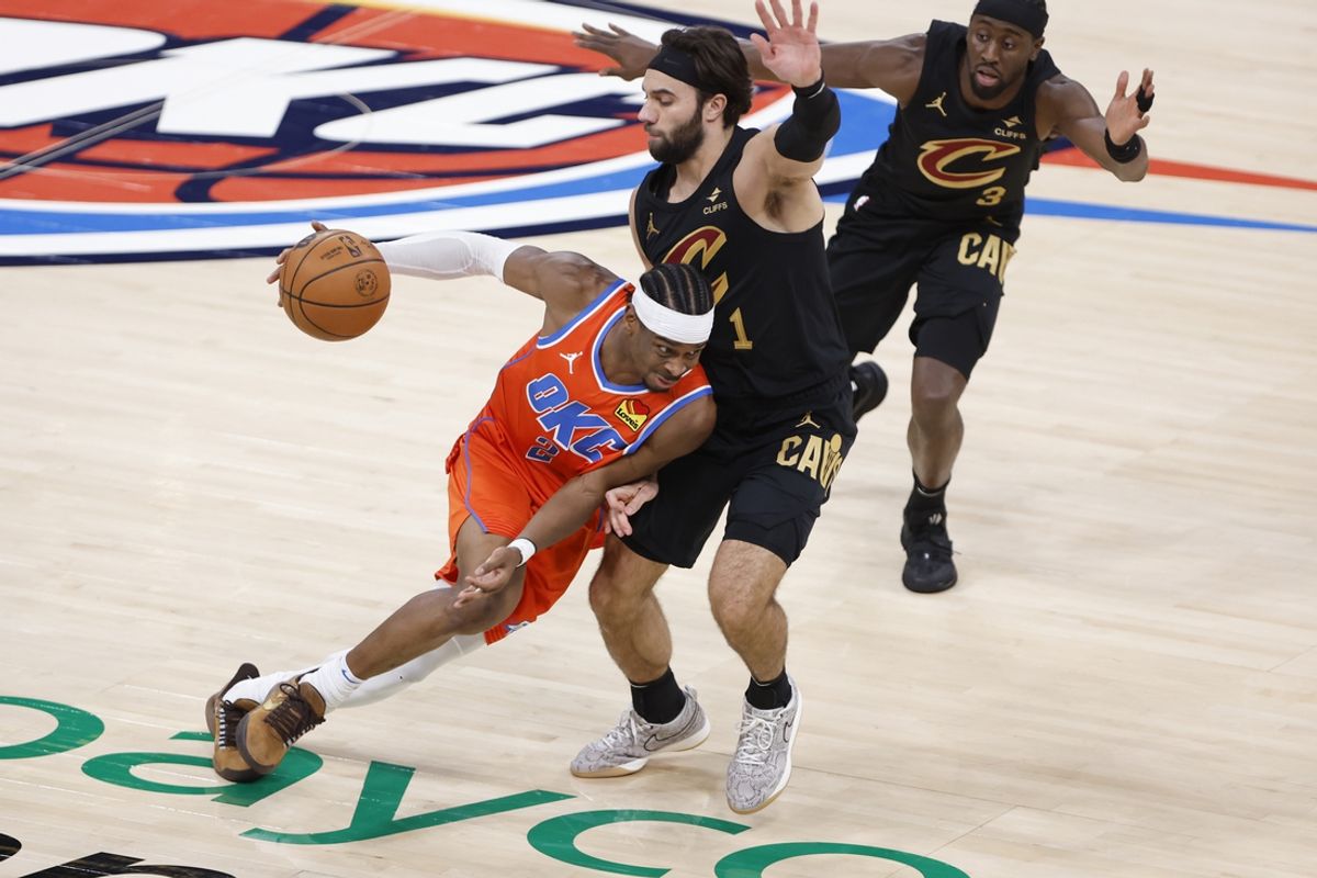 Jan 16, 2025; Oklahoma City, Oklahoma, USA; Oklahoma City Thunder guard Shai Gilgeous-Alexander (2) drives down the court as Cleveland Cavaliers guard Max Strus (1) defends during the fourth quarter at Paycom Center. Mandatory Credit: Alonzo Adams-Imagn Images