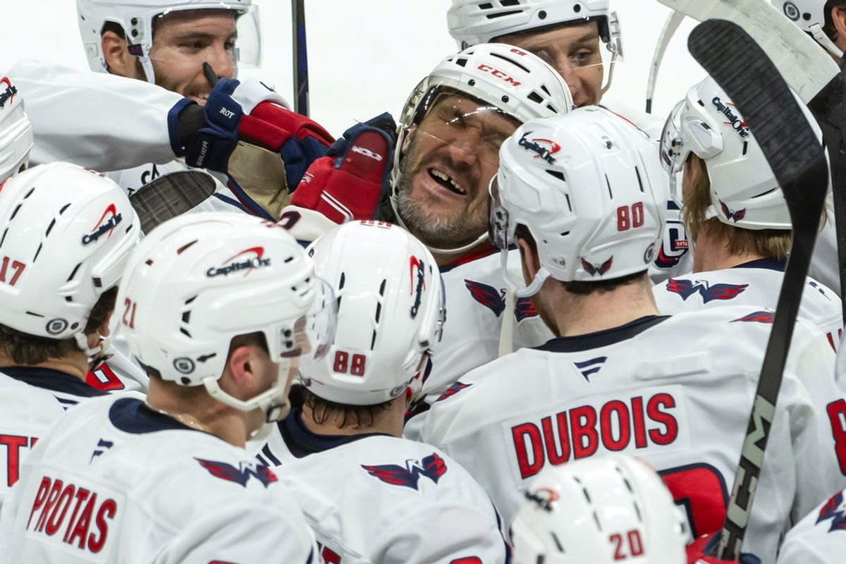 Jan 16, 2025; Ottawa, Ontario, CAN; Washington Capitals left wing Alex Ovechkin (8) celebrates with team after scoring a goal in overtime against the Ottawa Senators at the Canadian Tire Centre. Mandatory Credit: Marc DesRosiers-Imagn Images