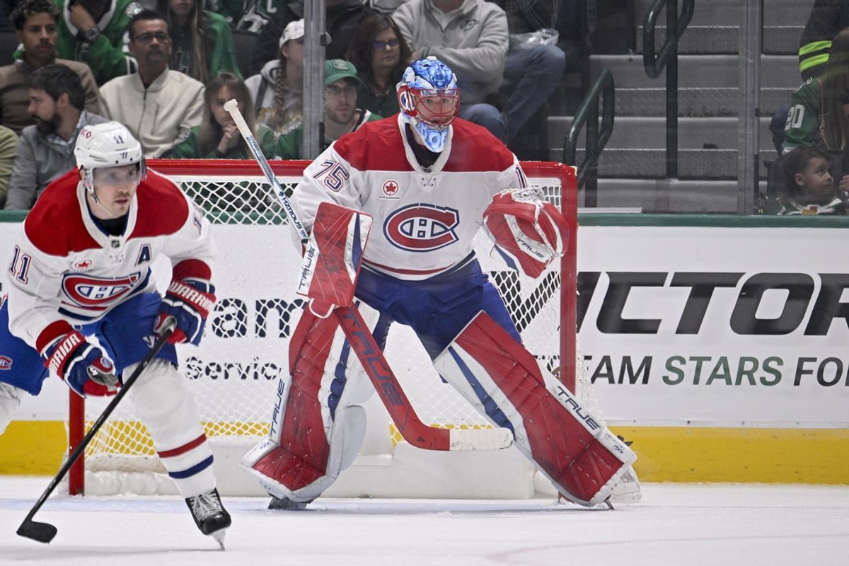 Jan 16, 2025; Dallas, Texas, USA; Montreal Canadiens goaltender Jakub Dobes (75) faces the Dallas Stars attack during the third period at the American Airlines Center. Mandatory Credit: Jerome Miron-Imagn Images