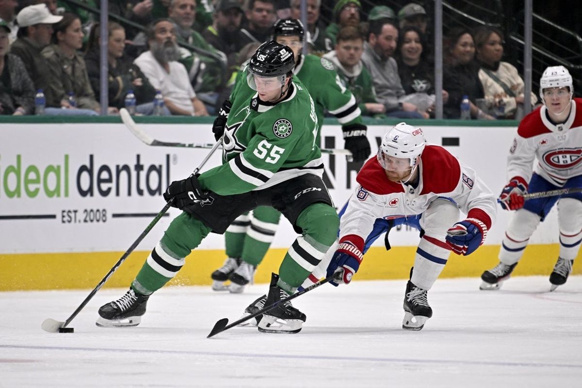 Jan 16, 2025; Dallas, Texas, USA; Dallas Stars defenseman Thomas Harley (55) skates with the puck in front of Montreal Canadiens defenseman Mike Matheson (8) during the third period at the American Airlines Center. Mandatory Credit: Jerome Miron-Imagn Images