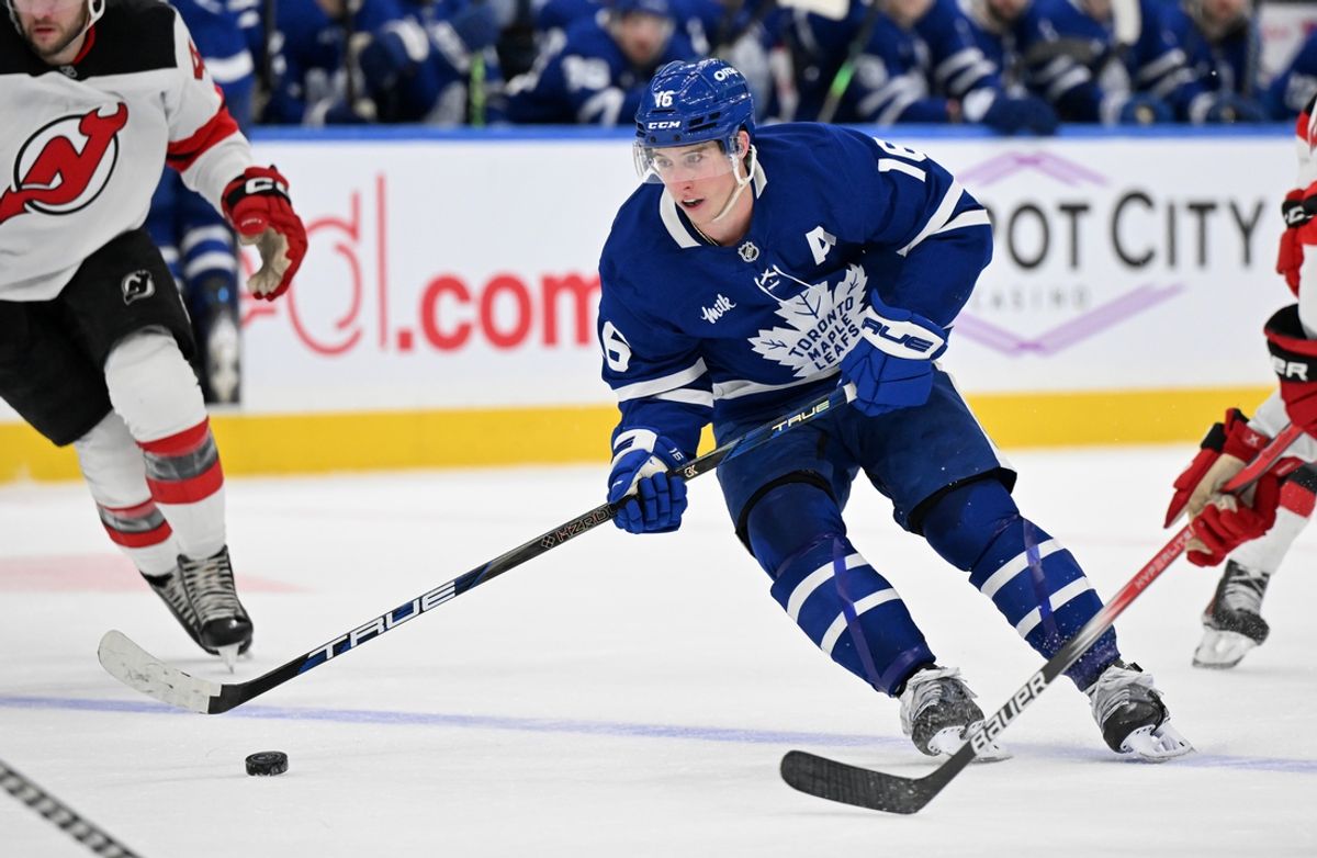 Jan 16, 2025; Toronto, Ontario, CAN;  Toronto Maple Leafs forward Mitch Marner (16) skates with the puck against the New Jersey Devils in the third period at Scotiabank Arena. Mandatory Credit: Dan Hamilton-Imagn Images