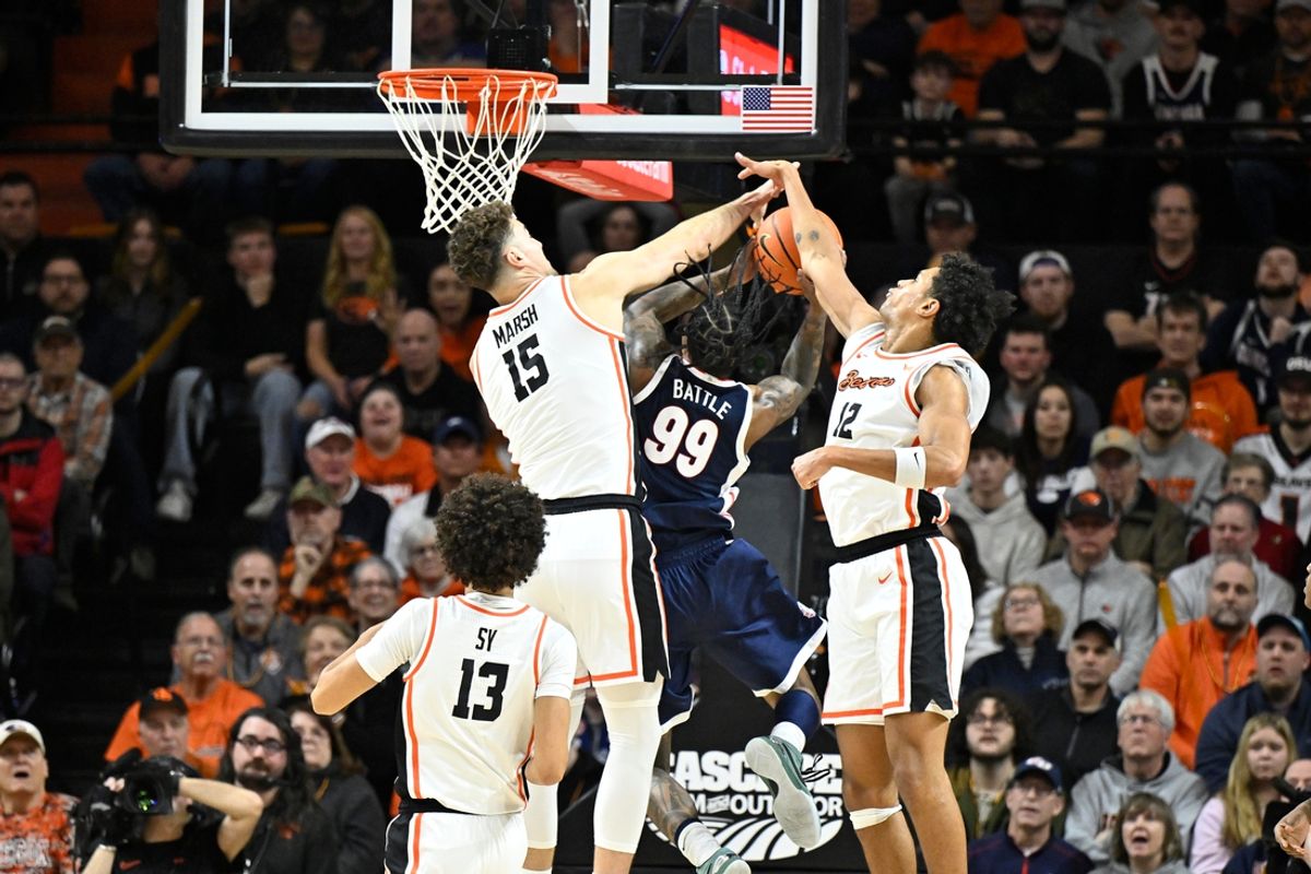 Jan 16, 2025; Corvallis, Oregon, USA; Gonzaga Bulldogs guard Khalif Battle (99) is fouled going to the basket by Oregon State Beavers center Matthew Marsh (15) during the first half at Gill Coliseum. Mandatory Credit: Craig Strobeck-Imagn Images