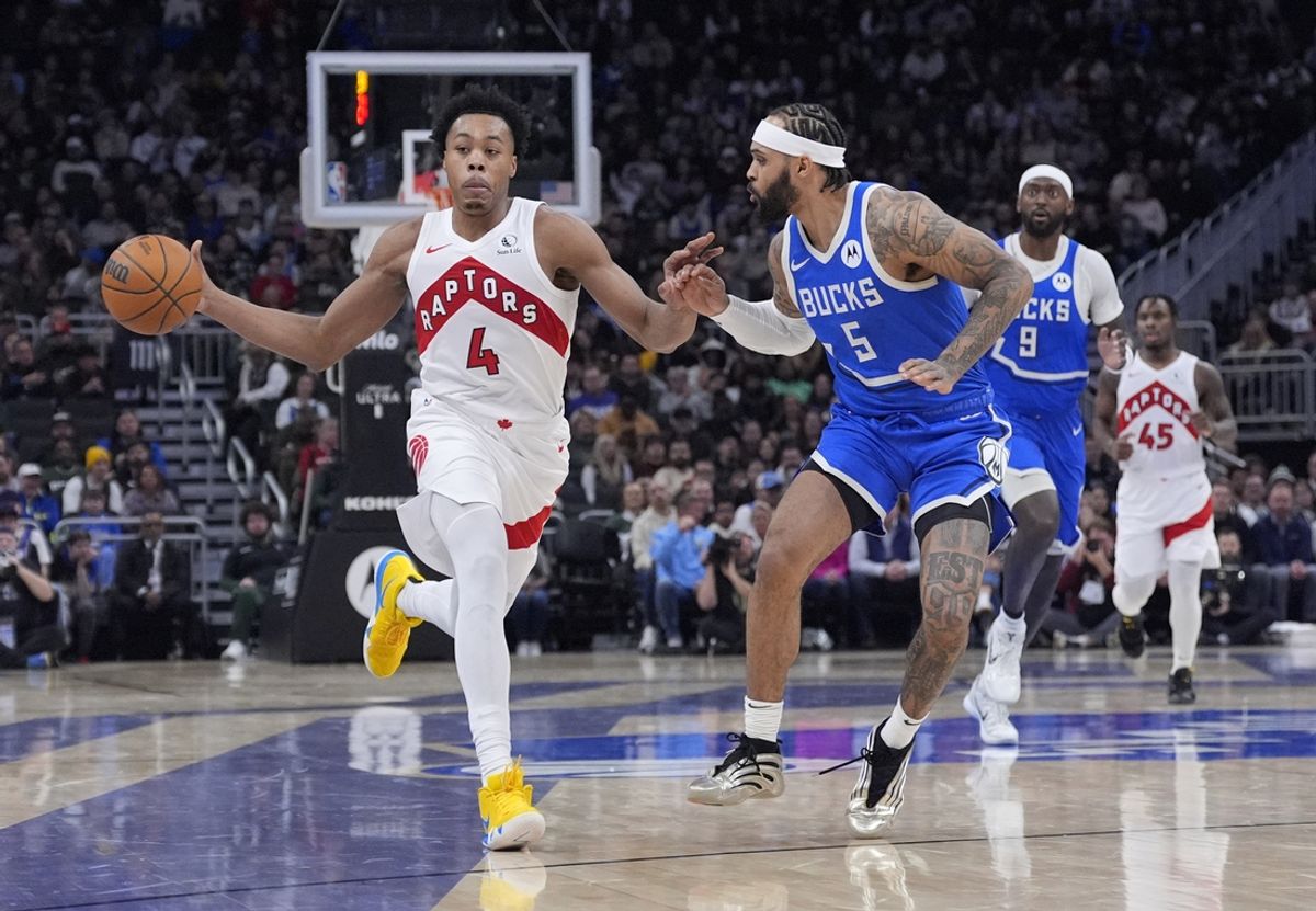 Jan 17, 2025; Milwaukee, Wisconsin, USA; Toronto Raptors forward Scottie Barnes (4) pushes the ball up the court against Milwaukee Bucks guard Gary Trent Jr. (5) in the first half at Fiserv Forum. Mandatory Credit: Michael McLoone-Imagn Images