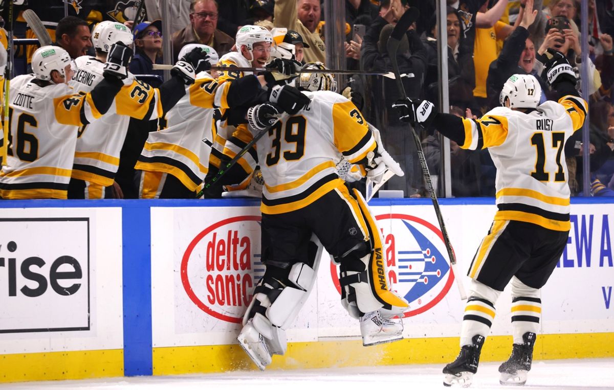 Jan 17, 2025; Buffalo, New York, USA;  Pittsburgh Penguins goaltender Alex Nedeljkovic (39) celebrates his goal with teammates during the third period against the Buffalo Sabres at KeyBank Center. Mandatory Credit: Timothy T. Ludwig-Imagn Images