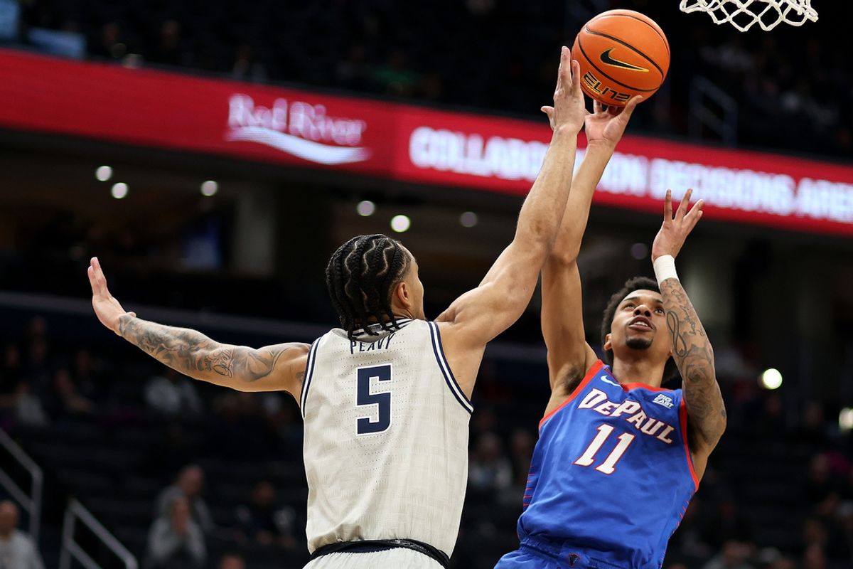 Jan 17, 2025; Washington, District of Columbia, USA; DePaul Blue Demons guard CJ Gunn (11) takes a shot over Georgetown Hoyas guard Micah Peavy (5) during the second half at Capital One Arena. Mandatory Credit: Daniel Kucin Jr.-Imagn Images