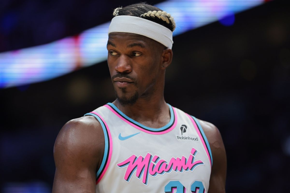 Jan 17, 2025; Miami, Florida, USA; Miami Heat forward Jimmy Butler (22) looks on against the Denver Nuggets during the third quarter at Kaseya Center. Mandatory Credit: Sam Navarro-Imagn Images