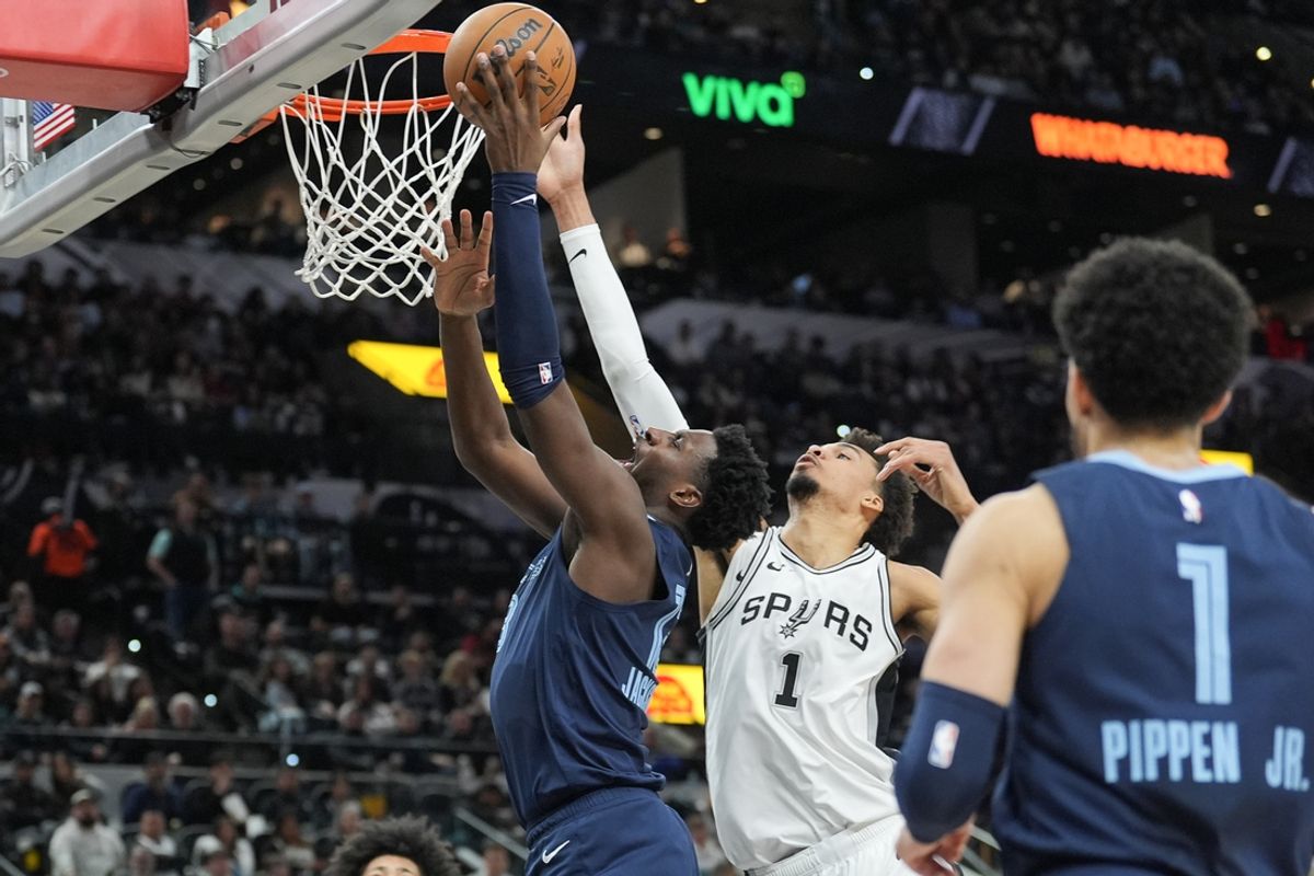 Jan 17, 2025; San Antonio, Texas, USA; Memphis Grizzlies guard Desmond Bane (22) shoots in front of San Antonio Spurs center Victor Wembanyama (1) in the first half at Frost Bank Center. Mandatory Credit: Daniel Dunn-Imagn Images
