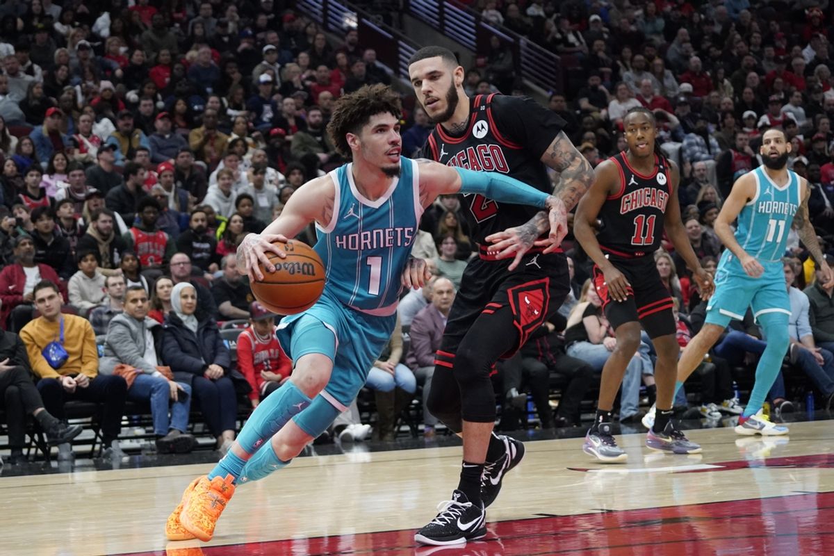 Jan 17, 2025; Chicago, Illinois, USA; Chicago Bulls guard Lonzo Ball (2) defends Charlotte Hornets guard LaMelo Ball (1) during the second half at United Center. Mandatory Credit: David Banks-Imagn Images