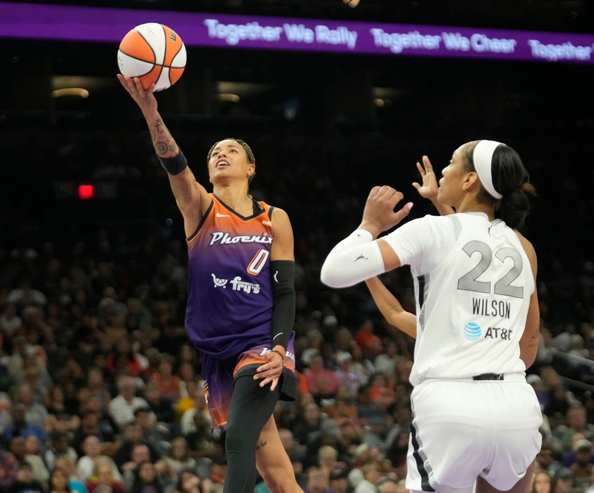 Phoenix Mercury guard Natasha Cloud (0) lays the ball in past Las Vegas Aces center A'ja Wilson (22) during the fourth quarter at Footprint Center in Phoenix on Sunday, Sept. 1, 2024.