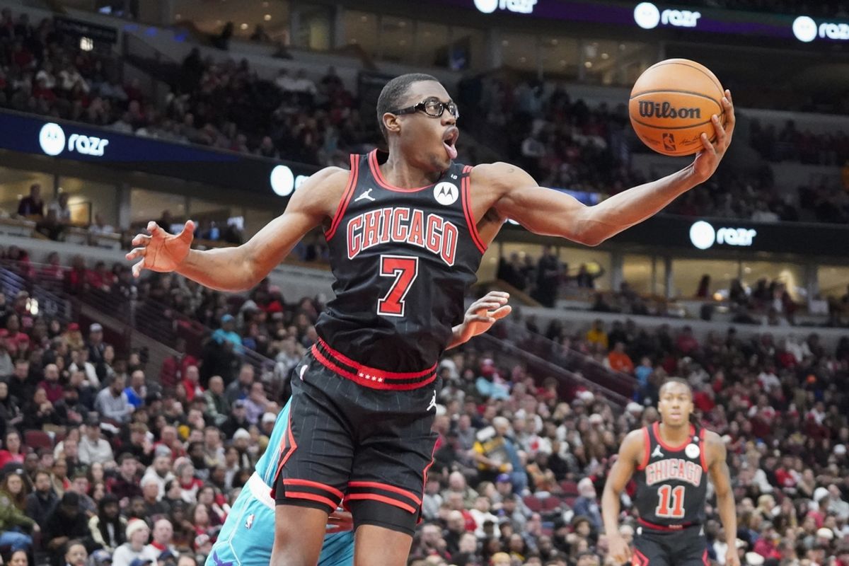 Jan 17, 2025; Chicago, Illinois, USA; Chicago Bulls forward Jalen Smith (7) agains the Charlotte Hornets  grabs a rebound during the second half at United Center. Mandatory Credit: David Banks-Imagn Images