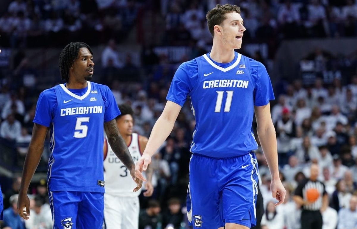 Jan 18, 2025; Storrs, Connecticut, USA; Creighton Bluejays center Ryan Kalkbrenner (11) and guard Jamiya Neal (5) look to the sideline as they take one the UConn Huskies in the first half at Harry A. Gampel Pavilion. Mandatory Credit: David Butler II-Imagn Images