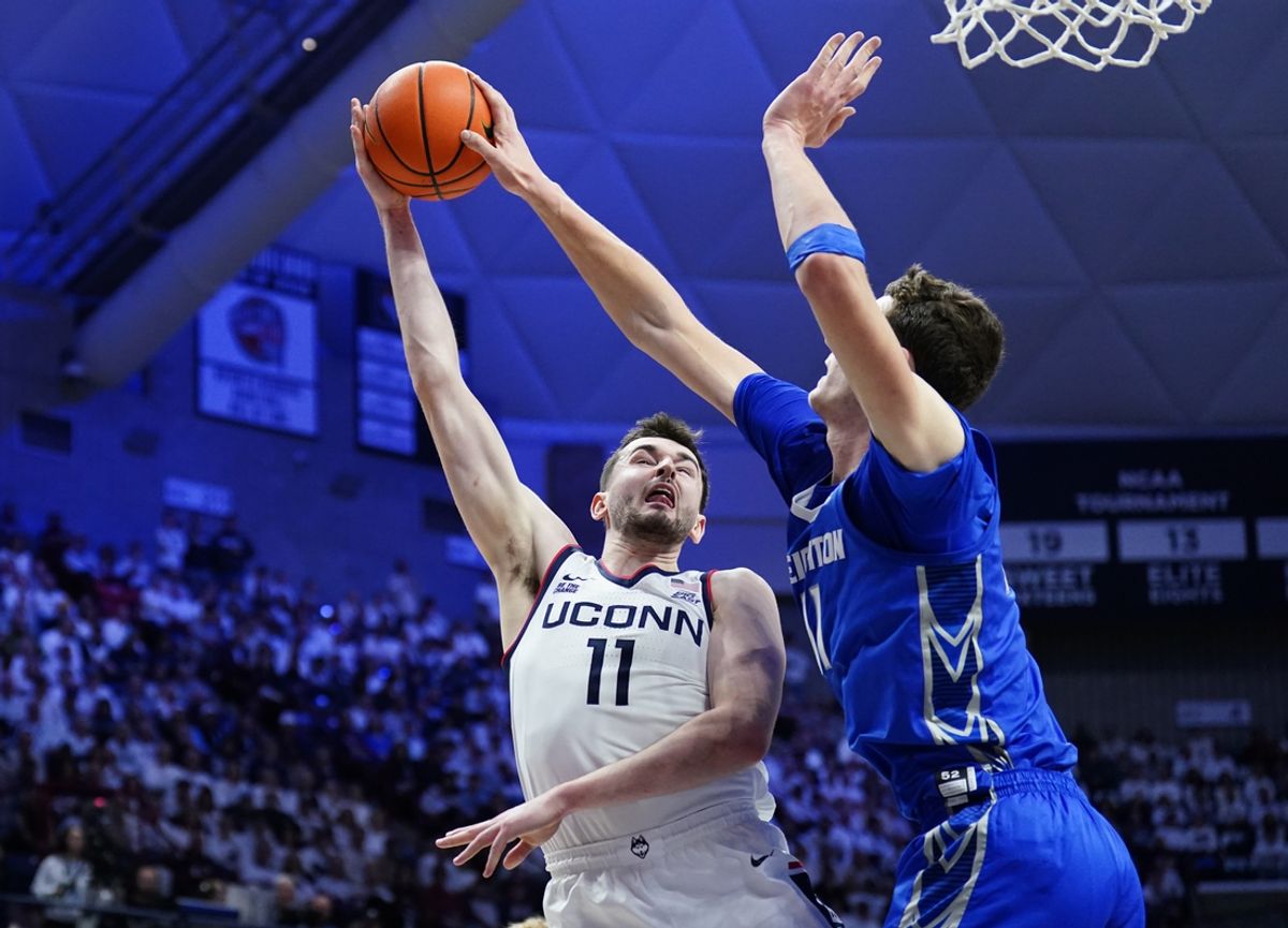Jan 18, 2025; Storrs, Connecticut, USA; Creighton Bluejays center Ryan Kalkbrenner (11) blocks the shot of UConn Huskies forward Alex Karaban (11) in the first half at Harry A. Gampel Pavilion. Mandatory Credit: David Butler II-Imagn Images