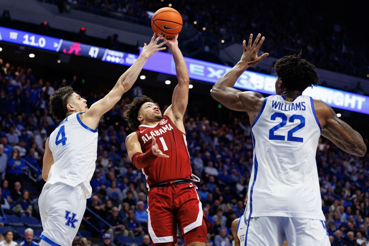 Jan 18, 2025; Lexington, Kentucky, USA; Alabama Crimson Tide guard Mark Sears (1) shoots the ball against Kentucky Wildcats guard Koby Brea (4) and center Amari Williams (22) during the first half at Rupp Arena at Central Bank Center. Mandatory Credit: Jordan Prather-Imagn Images