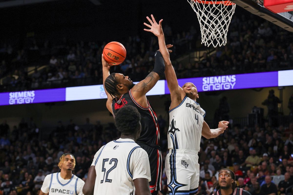 Jan 18, 2025; Orlando, Florida, USA; Houston Cougars forward J'Wan Roberts (13) goes to the basket against UCF Knights guard Keyshawn Hall (4) during the second half at Addition Financial Arena. Mandatory Credit: Mike Watters-Imagn Images